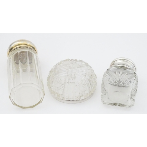 462 - A cut glass salts bottle with silver top hallmarked London 1923, maker Henry Perkins & Sons, a dress... 