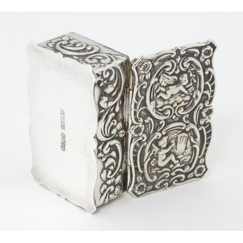 471 - A silver pill box with embossed decoration hallmarked Birmingham 1972, maker Joseph Gloster Ltd. App... 