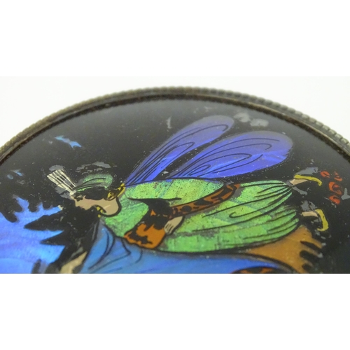 488 - A glass powder bowl with silver lid having butterfly wing decoration depicting a fairy, hallmarked B... 