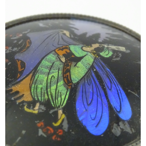 488 - A glass powder bowl with silver lid having butterfly wing decoration depicting a fairy, hallmarked B... 