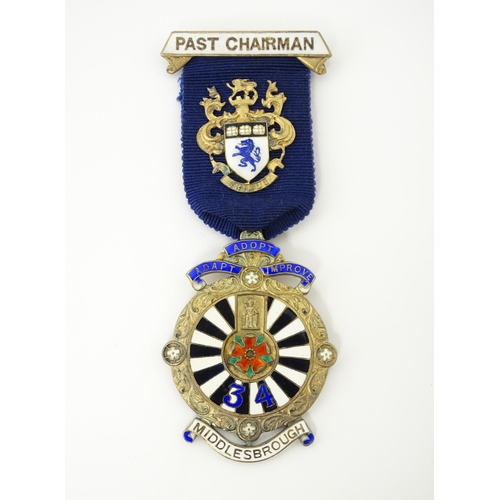 505 - A silver gilt Round Table jewel / medal with enamel decoration, titled Past Chairman, with motto 'Ad... 