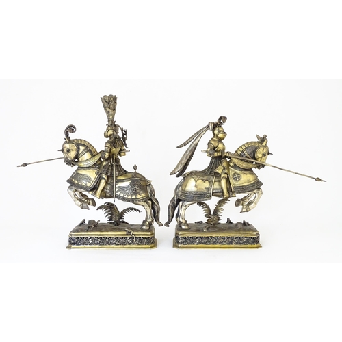 369 - A pair of silver gilt jousting knights on horseback, bearing marks probably for Neresheimer, Hanau, ... 