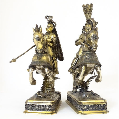 369 - A pair of silver gilt jousting knights on horseback, bearing marks probably for Neresheimer, Hanau, ... 