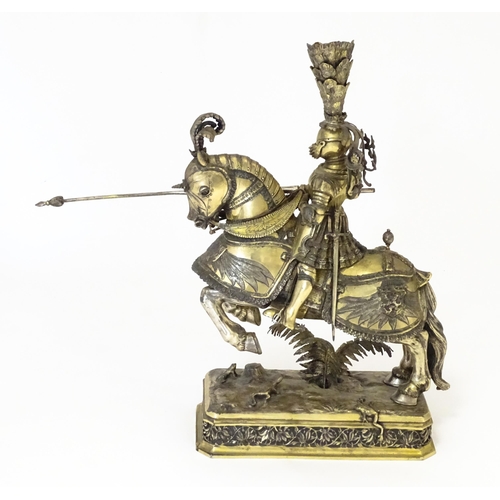 369 - A pair of silver gilt jousting knights on horseback, bearing marks probably for Neresheimer, Hanau, ... 