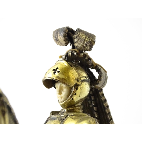 369 - A pair of silver gilt jousting knights on horseback, bearing marks probably for Neresheimer, Hanau, ... 