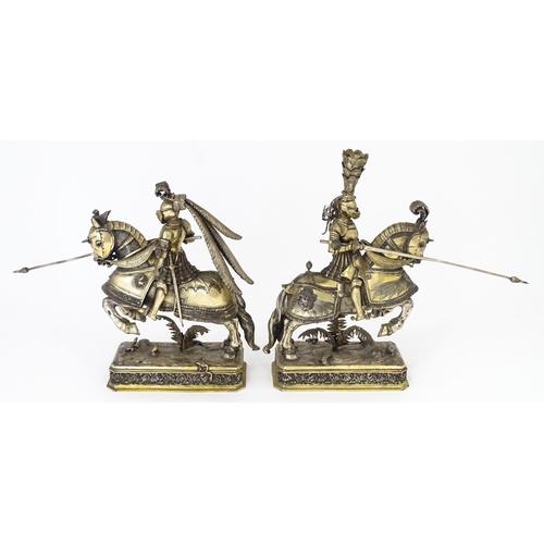 369 - A pair of silver gilt jousting knights on horseback, bearing marks probably for Neresheimer, Hanau, ... 