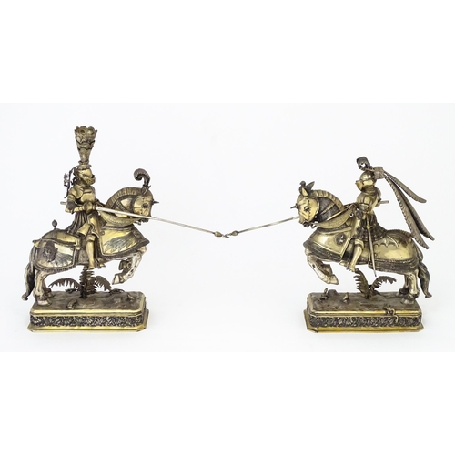 369 - A pair of silver gilt jousting knights on horseback, bearing marks probably for Neresheimer, Hanau, ... 