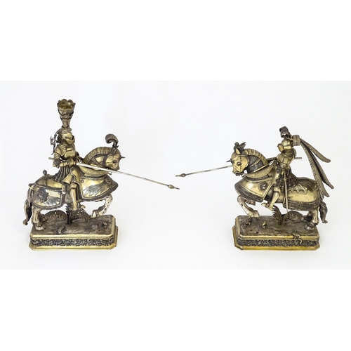 369 - A pair of silver gilt jousting knights on horseback, bearing marks probably for Neresheimer, Hanau, ... 