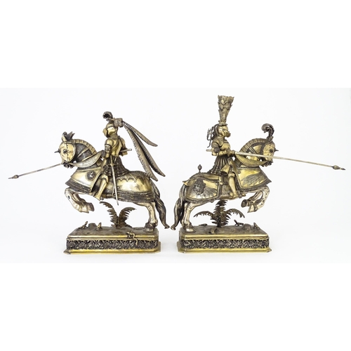 369 - A pair of silver gilt jousting knights on horseback, bearing marks probably for Neresheimer, Hanau, ... 