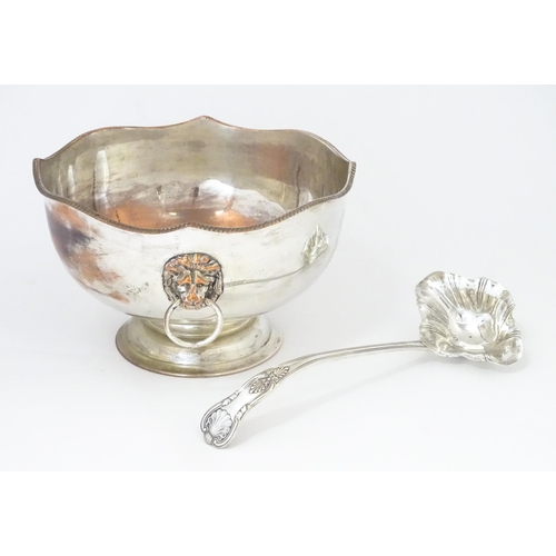 589 - A Large silver plate pedestal punch bowl with lion mask handles, together with a silver plate punch ... 