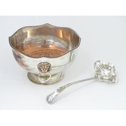 589 - A Large silver plate pedestal punch bowl with lion mask handles, together with a silver plate punch ... 