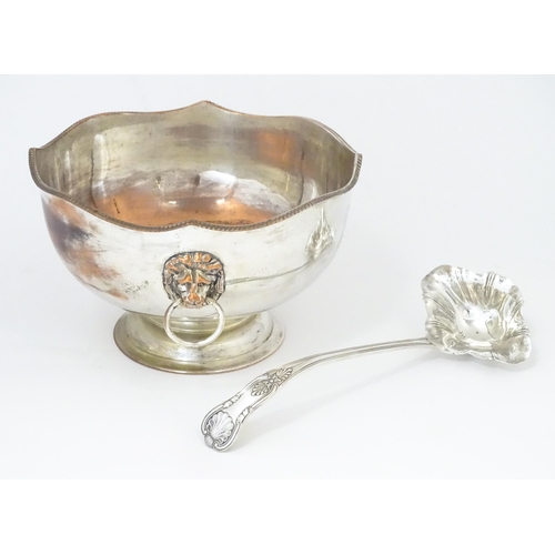 589 - A Large silver plate pedestal punch bowl with lion mask handles, together with a silver plate punch ... 