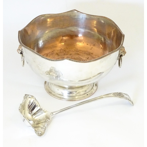 589 - A Large silver plate pedestal punch bowl with lion mask handles, together with a silver plate punch ... 