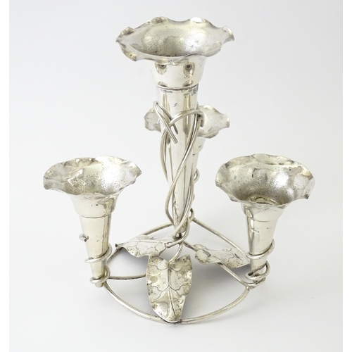 593 - An Art Nouveau silver plate centrepiece epergne with four flutes and foliate detail. Approx. 8