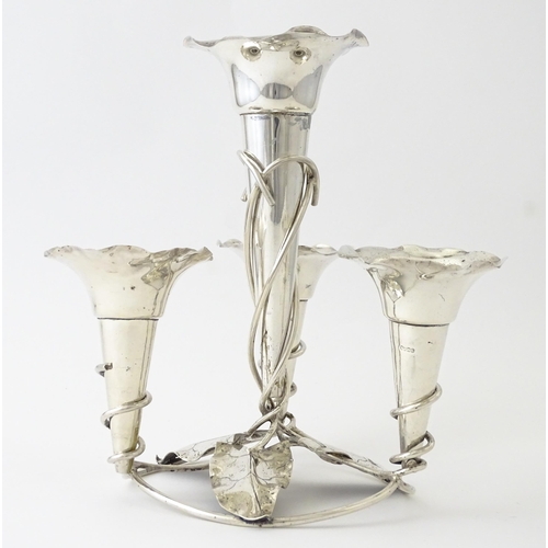 593 - An Art Nouveau silver plate centrepiece epergne with four flutes and foliate detail. Approx. 8