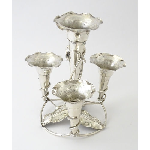 593 - An Art Nouveau silver plate centrepiece epergne with four flutes and foliate detail. Approx. 8