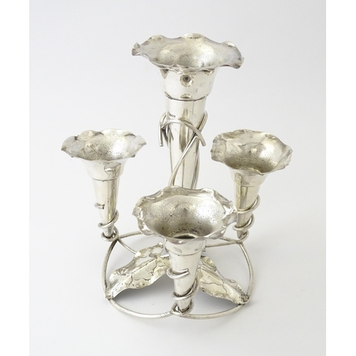 593 - An Art Nouveau silver plate centrepiece epergne with four flutes and foliate detail. Approx. 8