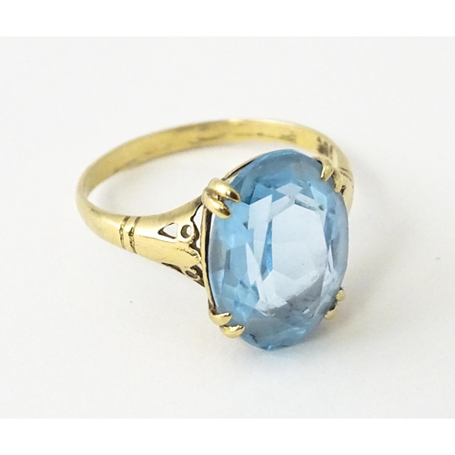 604 - A 9ct gold ring set with aquamarine. Ring size approx. N 1/2