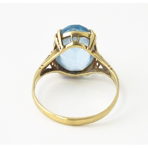 604 - A 9ct gold ring set with aquamarine. Ring size approx. N 1/2