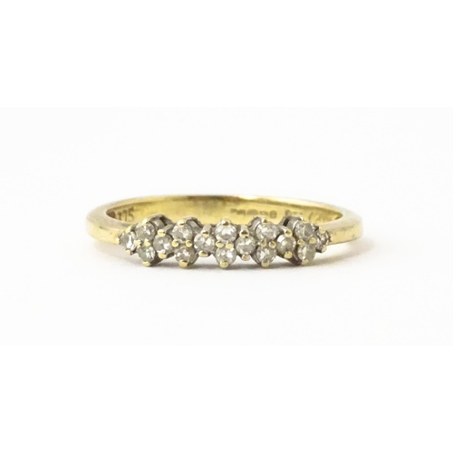 617 - A 9ct gold ring set with 16 diamonds. Ring size approx. K