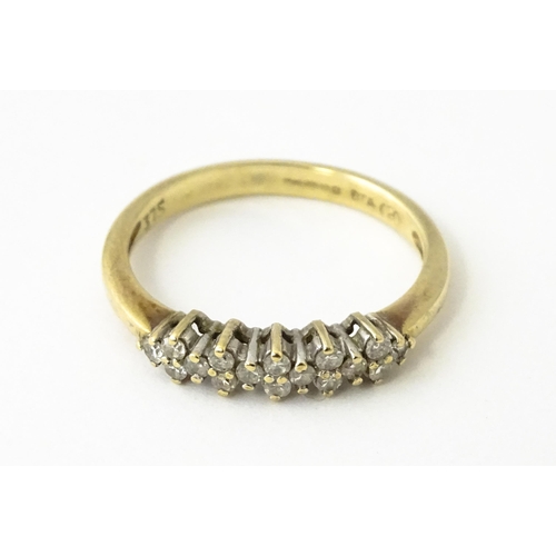 617 - A 9ct gold ring set with 16 diamonds. Ring size approx. K