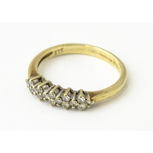 617 - A 9ct gold ring set with 16 diamonds. Ring size approx. K