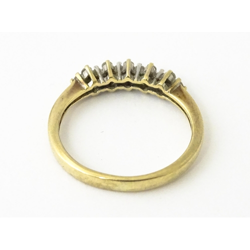 617 - A 9ct gold ring set with 16 diamonds. Ring size approx. K