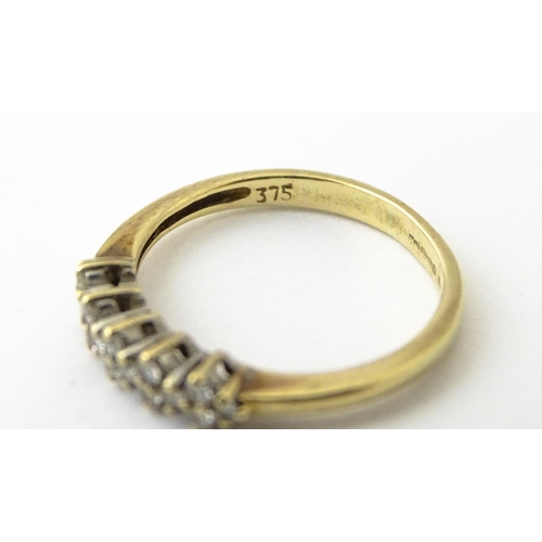 617 - A 9ct gold ring set with 16 diamonds. Ring size approx. K