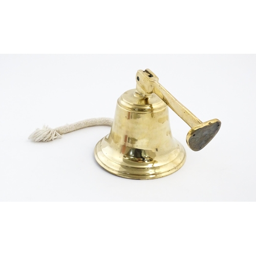 1087 - Nautical / Maritime Interest: A 20thC brass wall mounting ships bell. Approx. 6 1/2