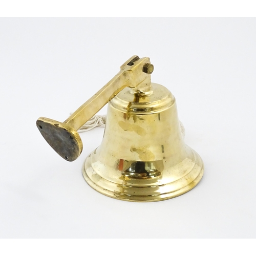 1087 - Nautical / Maritime Interest: A 20thC brass wall mounting ships bell. Approx. 6 1/2