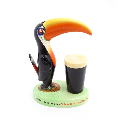 1102 - A 20thC Carlton Ware Guinness advertising Toucan lamp base, titled How Grand to be a Toucan, Just th... 