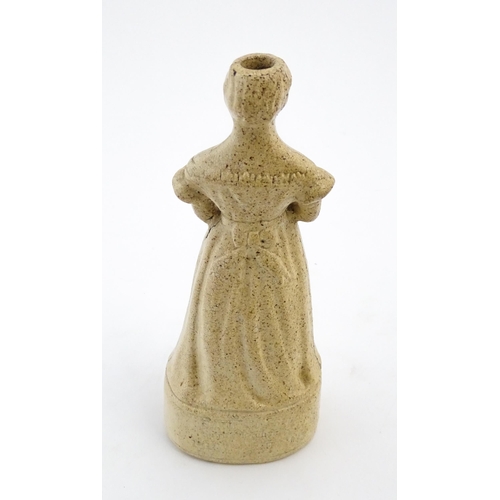 1105 - A Queen Victorian stoneware reform / spirit flask modelled as young Queen Victoria. The base titled ... 