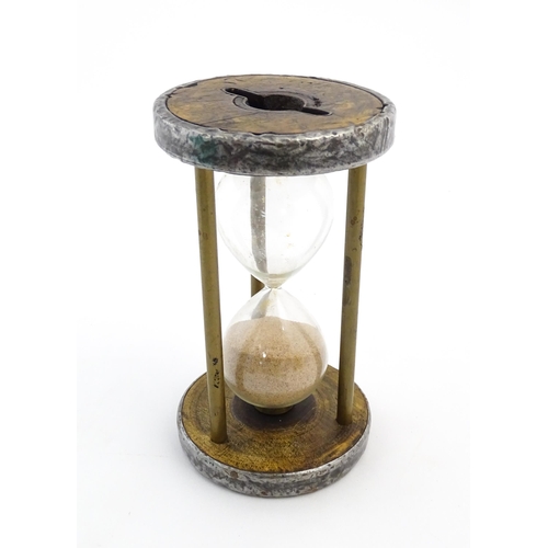 1111 - An early 20thC sand / egg timer with metal mounts. Approx. 6 1/4