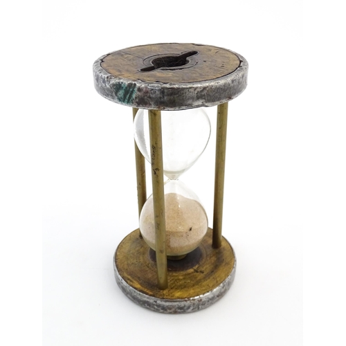 1111 - An early 20thC sand / egg timer with metal mounts. Approx. 6 1/4