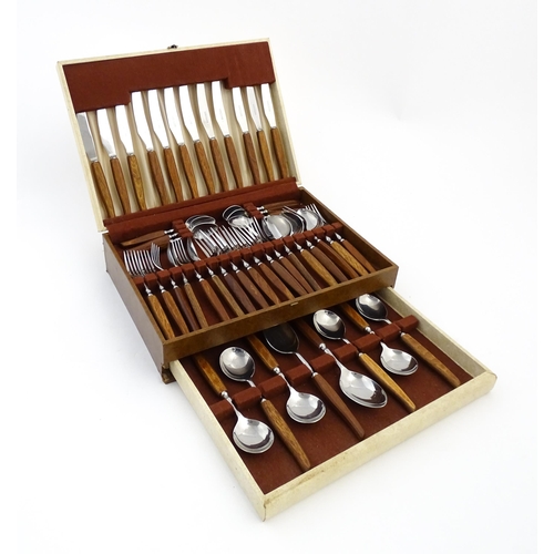 1115 - A vintage / retro Glosswood of Sheffield canteen of teak handled cutlery, comprising knives, forks a... 