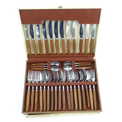 1115 - A vintage / retro Glosswood of Sheffield canteen of teak handled cutlery, comprising knives, forks a... 