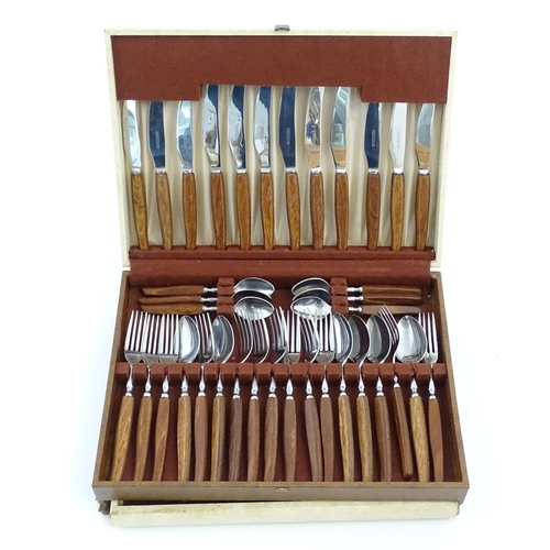 1115 - A vintage / retro Glosswood of Sheffield canteen of teak handled cutlery, comprising knives, forks a... 