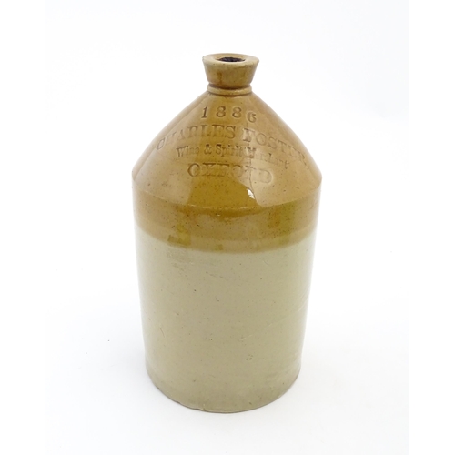 1117 - A Victorian two tone stoneware flagon marked 1886 Charles Foster Wine & Spirit Merchant Oxford. Appr... 