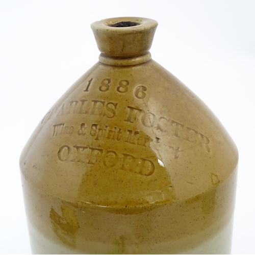 1117 - A Victorian two tone stoneware flagon marked 1886 Charles Foster Wine & Spirit Merchant Oxford. Appr... 