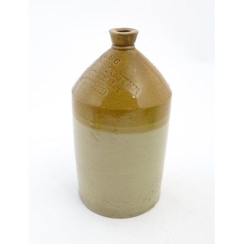 1117 - A Victorian two tone stoneware flagon marked 1886 Charles Foster Wine & Spirit Merchant Oxford. Appr... 