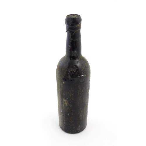 1118 - A 1960 vintage bottle of Taylor's port, the neck with wax seal stamped with the merchant name and da... 