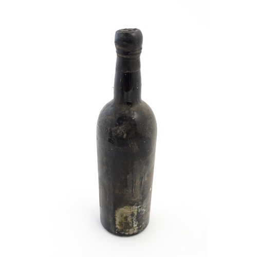 1118 - A 1960 vintage bottle of Taylor's port, the neck with wax seal stamped with the merchant name and da... 