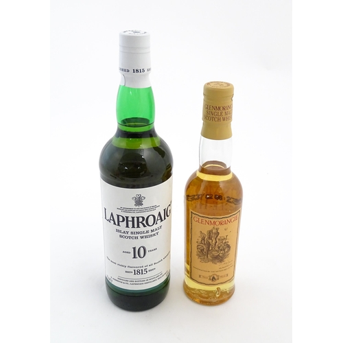 1120 - Two bottles of single malt Scotch whisky, comprising a 70cl bottle of Laphroaig and a 35cl bottle of... 