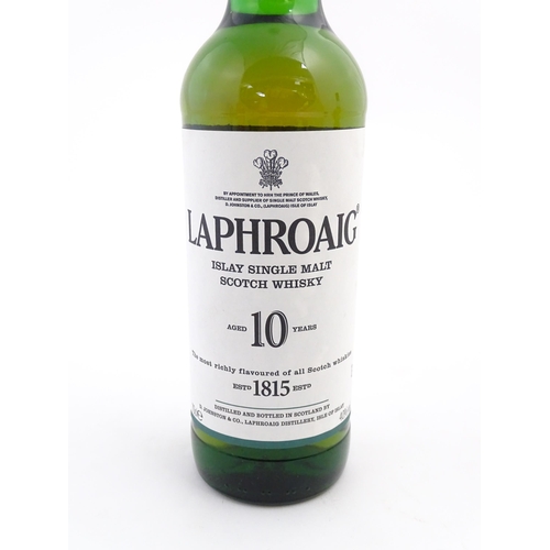 1120 - Two bottles of single malt Scotch whisky, comprising a 70cl bottle of Laphroaig and a 35cl bottle of... 