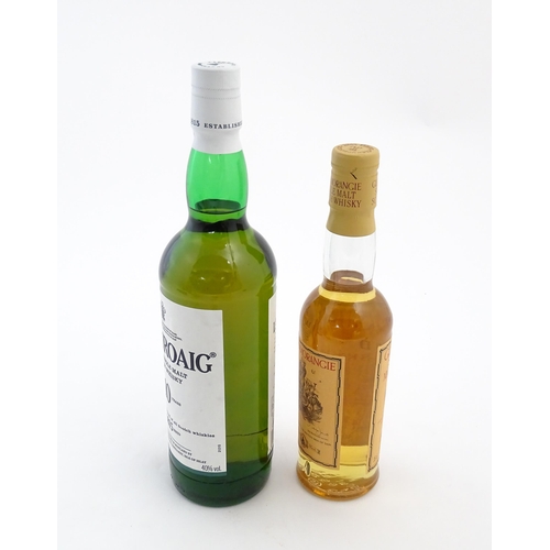 1120 - Two bottles of single malt Scotch whisky, comprising a 70cl bottle of Laphroaig and a 35cl bottle of... 