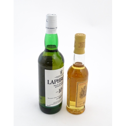 1120 - Two bottles of single malt Scotch whisky, comprising a 70cl bottle of Laphroaig and a 35cl bottle of... 