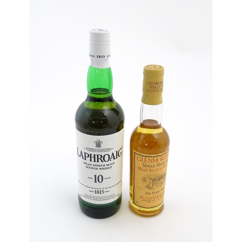 1120 - Two bottles of single malt Scotch whisky, comprising a 70cl bottle of Laphroaig and a 35cl bottle of... 