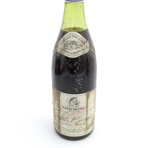 1129 - Seven bottles of vintage red wine, comprising a 1966 75cl bottle of Chateau Haut-Brion, two 1969 75c... 