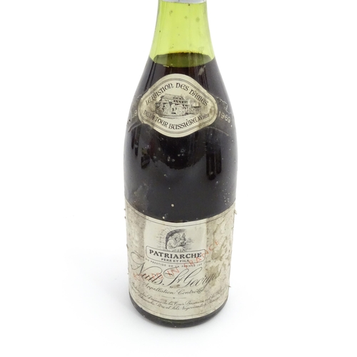 1129 - Seven bottles of vintage red wine, comprising a 1966 75cl bottle of Chateau Haut-Brion, two 1969 75c... 