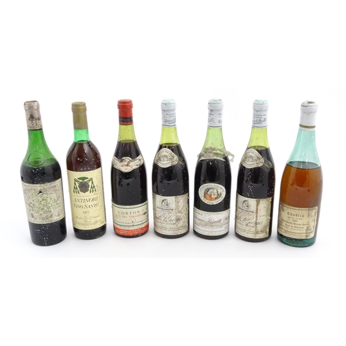 1129 - Seven bottles of vintage red wine, comprising a 1966 75cl bottle of Chateau Haut-Brion, two 1969 75c... 